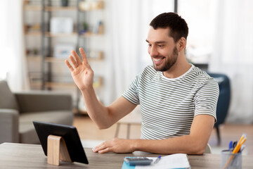 Canvas Print - technology, remote job and business concept - man with tablet pc computer having video call and working at home office