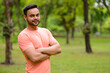 © Ranta Images - Happy young handsome bearded Indian man at the park