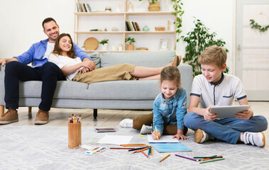 Wall Mural - Happy Parents Relaxing While Kids Playing At Home