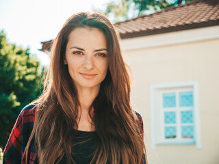 Closeup portrait of beautiful cute brunette model. Trendy girl posing in the street background. Funny and positive woman having fun outdoors