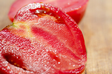 cut tomato close-up on the cutting Board. Fresh vegetables tomatoes in the cooking process