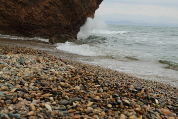 Sea coast with rocks on a foggy day