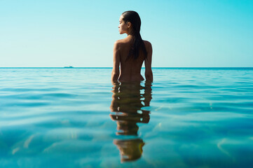 Beautiful brunette woman on the beach