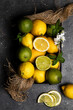 © Foodie Love/ADDICTIVE STOCK - From above view still life of limes and lemons basket placed on dark textured surface