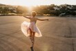 © Gustavo Pozo/ADDICTIVE STOCK - Full body of delighted unrecognizable female artist in elegant dance dress laughing and dancing in back lit in empty square with blurred town in background in sunny summer sunset day
