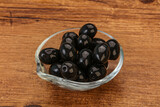 Fototapeta Kuchnia - Black olives in the bowl