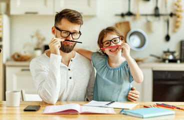 Wall Mural - Father and daughter having fun during home studies.