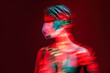© Manuel Ruiz/ADDICTIVE STOCK - Plastic female dummy with naked chest and in protective mask showing concept of COVID 19 prevention while illuminated by neon light in long exposure
