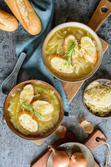 Sticker - Classic French onion soup in a ceramic bowl, topped with baguette slices and shredded cheese