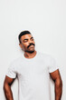 © Victor Torres/ADDICTIVE STOCK - Serious black man with casual outfit posing over white background looking away