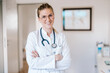 © Westend61 - Portrait of smiling female doctor with crossed arms
