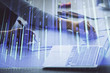 © peshkova - Double exposure of businesswoman hands typing on computer and forex chart hologram drawing. Financial analysis concept.