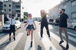© Westend61 - Group of carefree friends jumping on a street in the city