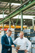 © Westend61 - Two businessmen using tablet in a factory