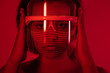 © Westend61 - Close-up of woman wearing red light therapy mask against wall at home