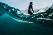 © Cavan Images - Split image of female surfer surfing a small wave