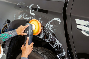 Wall Mural - Man hands holding the work tool polish the car.Buffing and polishing car.