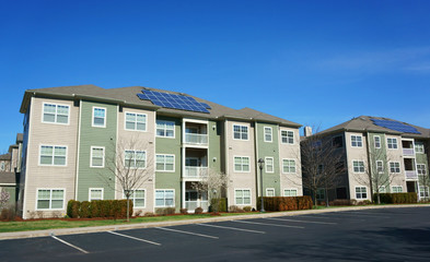 Poster - modern apartment buildings with solar panel on roof