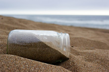 Glass Jar On The Beach