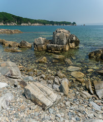 Large stone structures in the sea with clear water