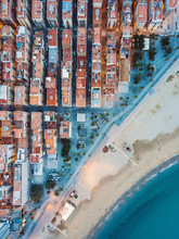 Barceloneta Beach In Barcelona, Spain, Unique Architecture Modern Buildings Pattern Sunset Lights. Aerial Top View Drone Shot