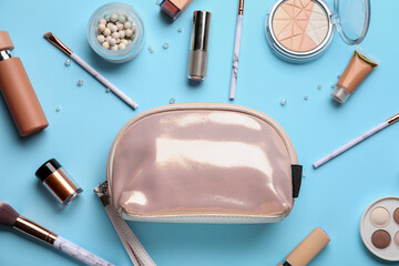 Composition with cosmetic bag on color background