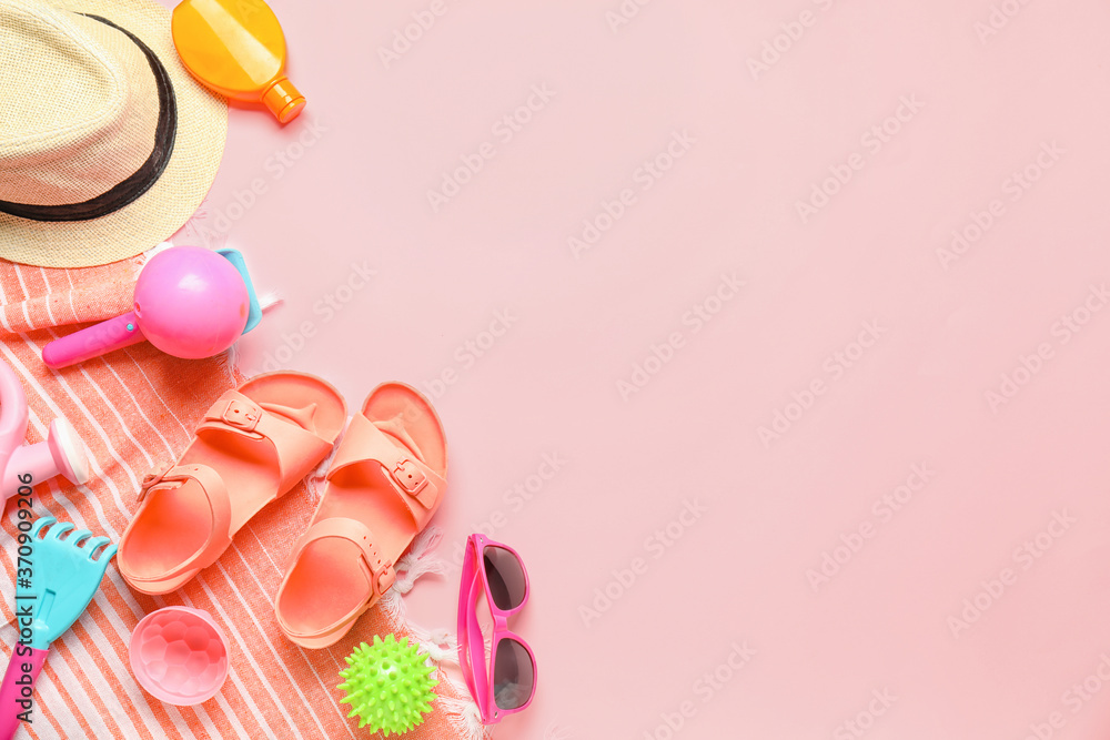 Set of beach accessories for children on color background