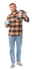 Poster - Young man with electric kettle and cup on white background