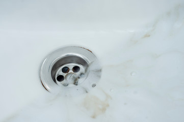 Wall Mural - Photo before and after washing off the detergent foam from the surface of the sink