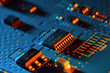© Raimundas - Electronic circuit board with electronic components such as chips close up. Blurry background.