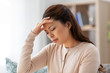© Syda Productions - people and health problem concept - sick asian woman having headache at home