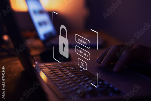 Fotografía user typing login and password, cyber security concept, data protection and secu