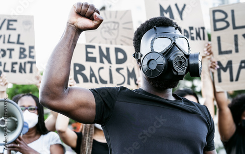 Plakat Activist wearing gas mask protesting against racism and fighting for equality - Black lives matter demonstration on street for justice and equal rights - Blm international movement concept