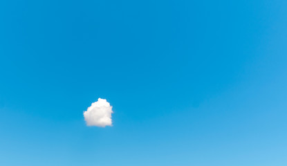 Wall Mural - one white cloud against a blue sky