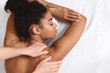 canvas print picture - Closeup of black young woman having healing body massage