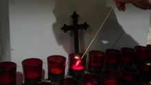 Lighting Prayer Candle In Church