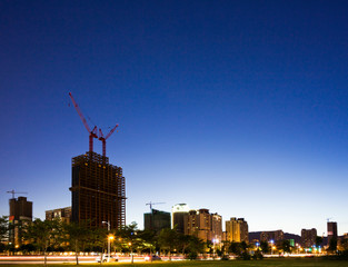 building construction site and cranes with the blue sky background