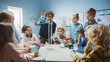 © Gorodenkoff - Elementary School Science / Chemistry Classroom: Teacher Shows Chemical Reaction Experiment to Group of Children. Mixing Chemicals in Beaker to get Reaction. Children Use Digital Tablet Computers