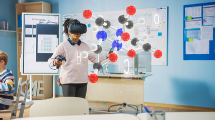 Wall Mural - Cute Girl Wearing Augmented Reality Headset and Using Controllers Interacts with 3D Molecule. Futuristic School Science Class for Children Learning in STEM Programs. VFX, Special Effects Render