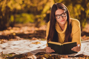 Wall Mural - Photo of focused girl tourist hide city center countryside lying checkered plaid blanket fall forest lawn grass read book wear yellow color sweater jumper