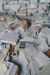 © stokkete - Screaming businessman drowning under a lot of paperwork