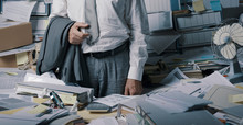 Stressed Businessman Overloaded With Paperwork