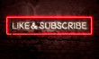 Like And Subscribe Graphic Neon Sign On Brick Wall For Social Media Videos