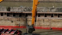 Large Excavators Engaged In Cleaning Of The Riverbed Of A River From The Mud And Debris.
Large Excavators On Pontoons Engaged In Cleaning Of The Riverbed Of A River From The Mud And Debris.

