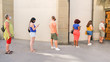 © Sabrina - People in a queue with social distancing and wearing protective face masks - Concept of the coronvirus lifestyle and social distancing
