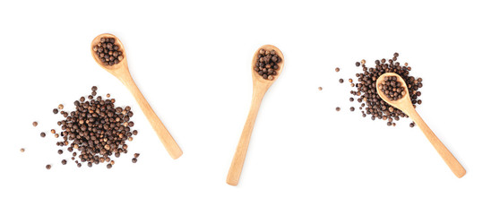 Wooden spoon and black pepper isolated