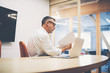 © BullRun - Skilled mature executive reviewing a contract before meeting with her new project partners. Experienced businessman reading paper documents before presentation in boardroom office interior. Filter