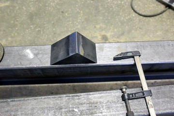 After grinding, the iron corner lies in the workshop