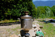 Vintage metal copper tea samovar. Samovar side view. Retro soot grunge tea samovar. Ancient Azerbaijan samovar. A device for making tea.