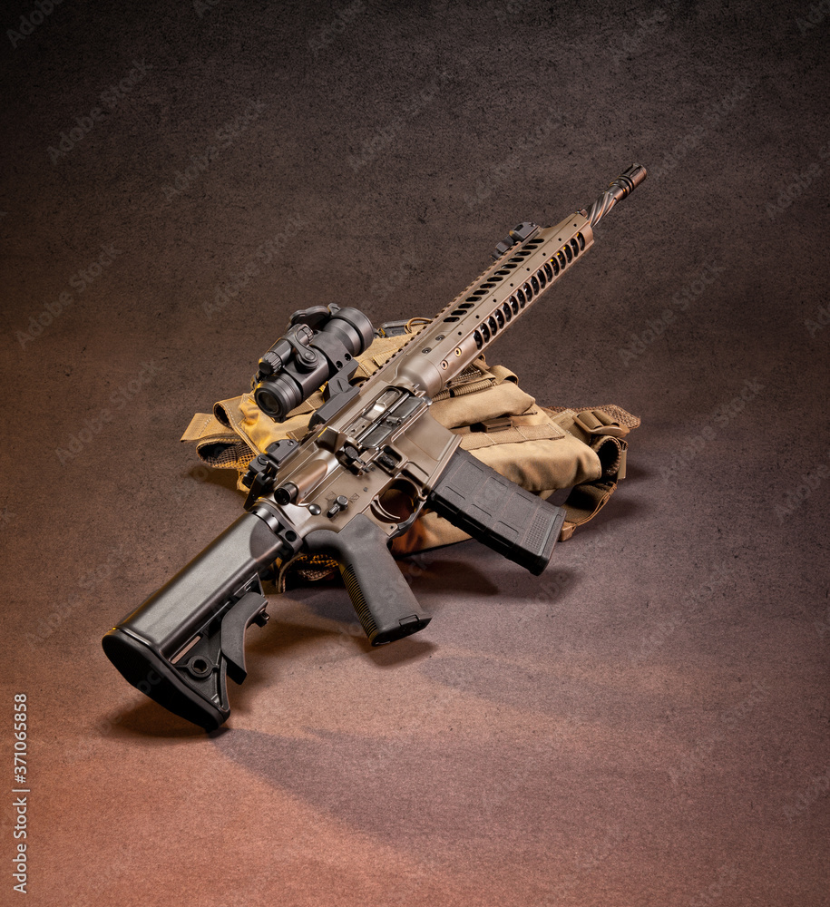 Ar 15 Style Rifle Displayed On Top Of Gear Shot In Studio Stock Photo
